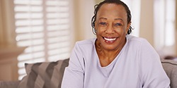 Smiling, healthy woman with dental implants in Cambridge 