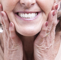 Closeup of smiling woman with dental implants in Cambridge