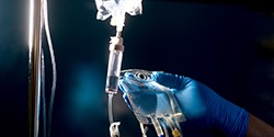 Gloved hand working with drip for IV sedation in  Marietta, OH