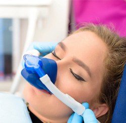 Woman having nasal mask placed for nitrous oxide sedation in Marietta, OH