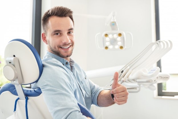 Man smiling during dental visit.