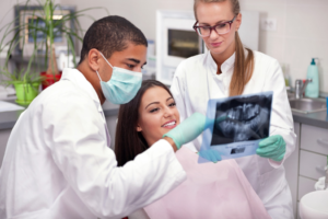 a patient attending their dental implant consultation 