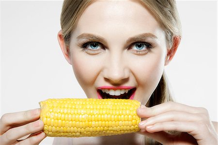 person eating corn on the cob